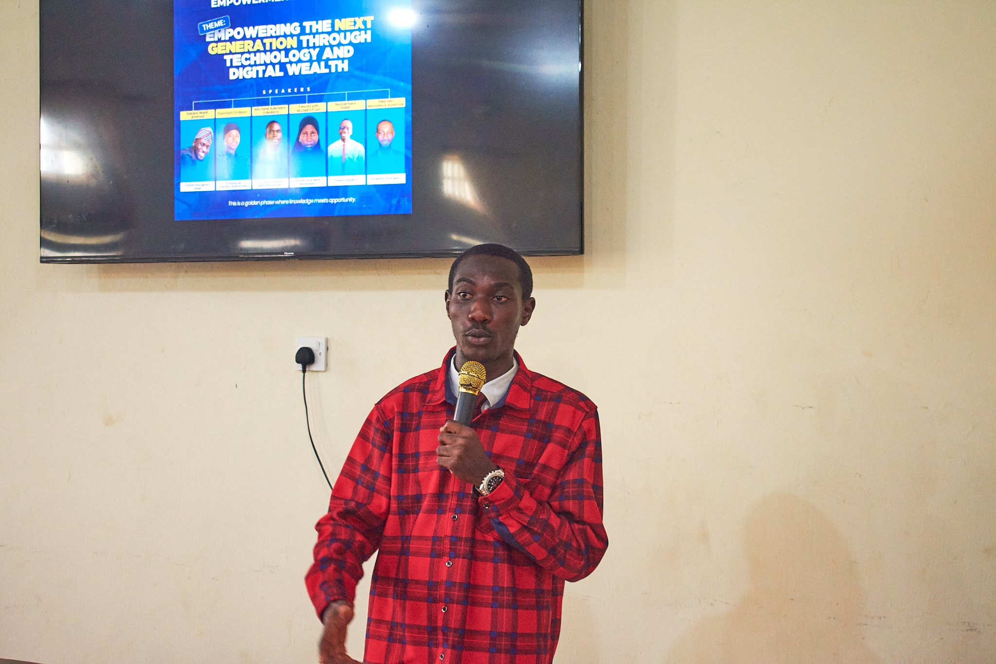 Stephen Marvelous Ayomide delivering keynote presentation visuals on stage at Tech and Wealth Summit